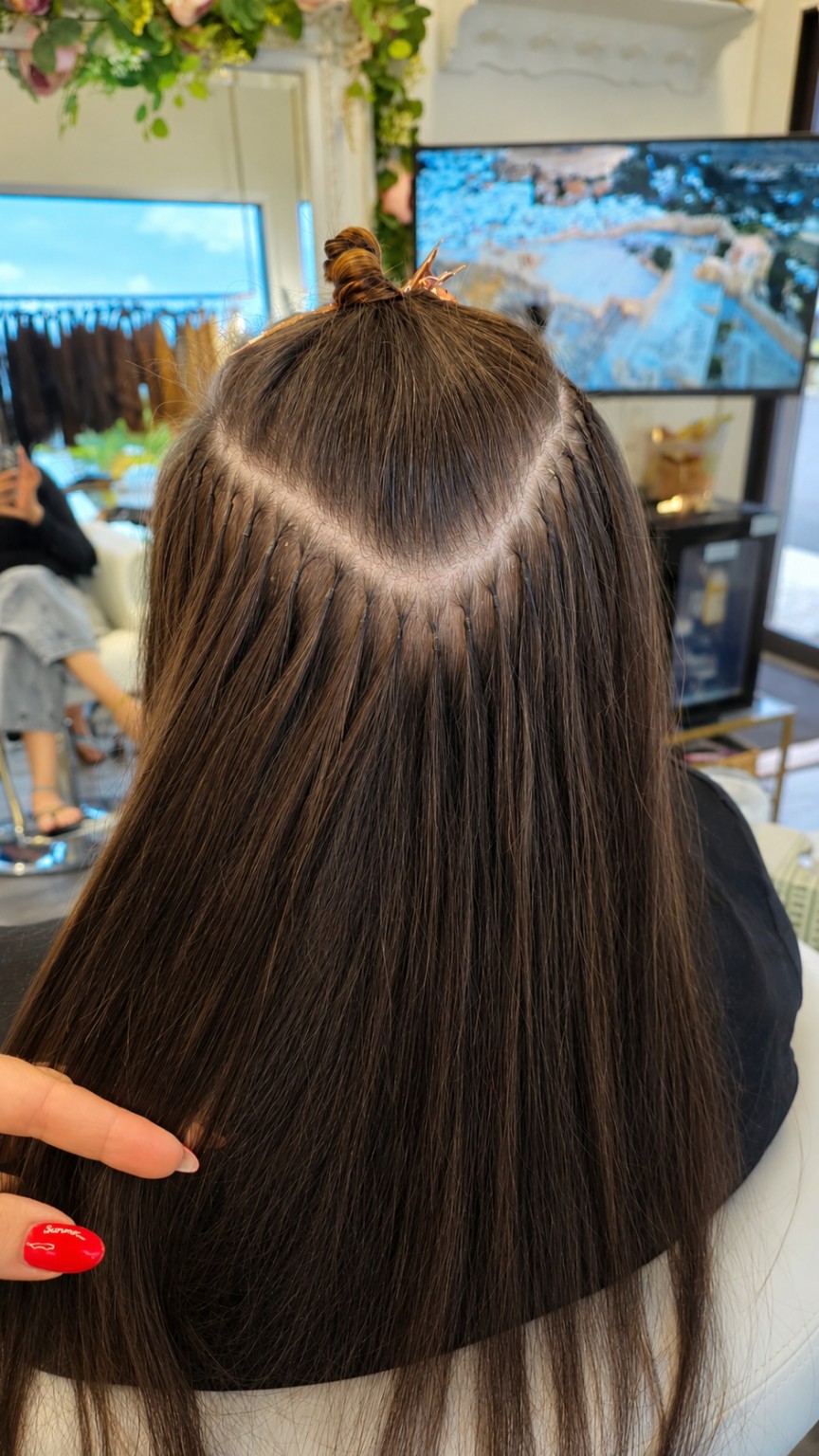 Close-up of precise, discreet individual extension bonds during installation